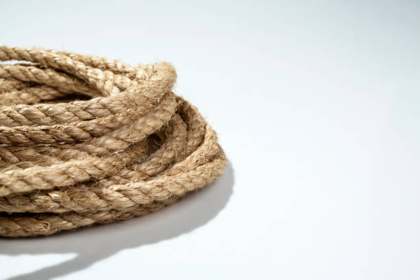 istock Closeup view of coiled ropes string isolated over a white background 2203159138