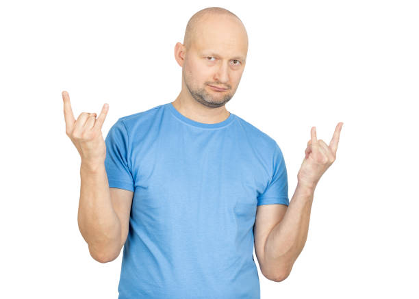 istock Bald man showing rock and roll hand gesture on white background 2203159242