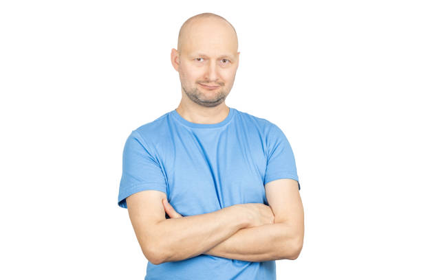 istock Confident smiling bald man with folded arms on white background 2203159308