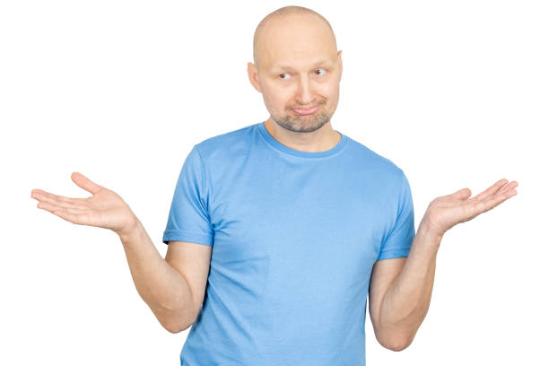istock Puzzled man shrugging shoulders and showing empty hands on white background 2203159629