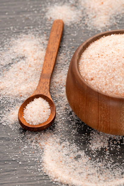 istock Fine Himalayan salt in bowl and spoon - Pink crystals 2203160701