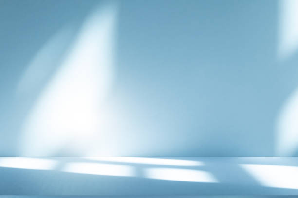 istock Studio style background wall decoration presentation uses white and blue tones. with shadows cast from a nearby window, concept creating a decorative 2203162803
