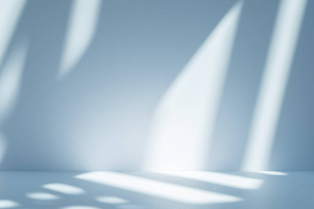 istock Studio style background wall decoration presentation uses white and blue tones. with shadows cast from a nearby window, concept creating a decorative 2203162806