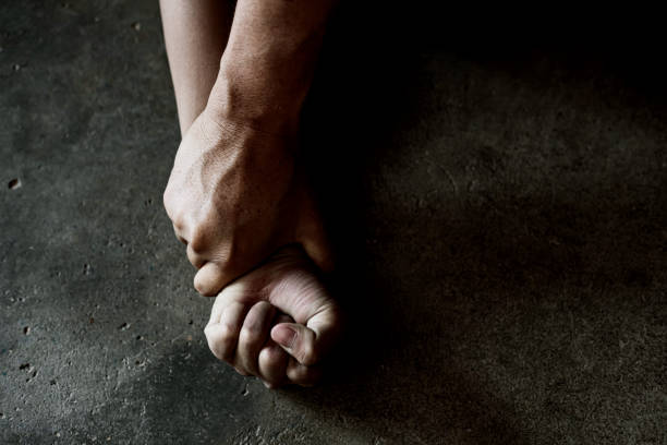 istock Hands for rape and sexual abuse concept.Sexual abuse is a problem or Social issues concept. Man's hand holding a woman hand for rape and sexual abuse. 2203164189