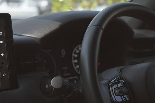 istock interior view of car with black leather, steering wheel with button 2203164696