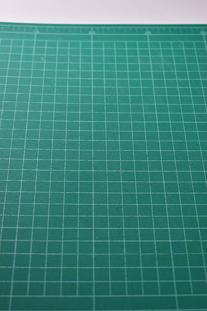 istock green cutting mat board on white background with line and scale measure guide pattern for object art design, tool equipment of diy craft work 2203164919