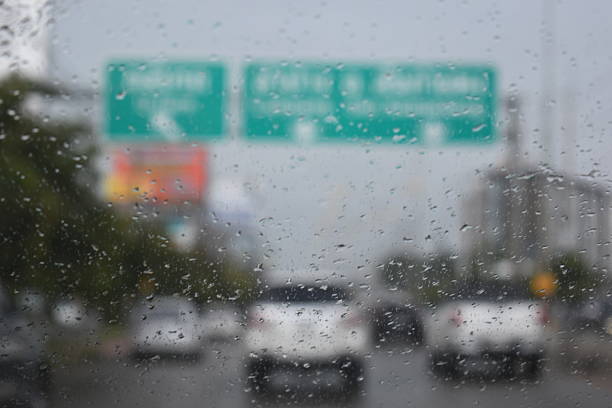 car on highway road with rainny season, blurred image