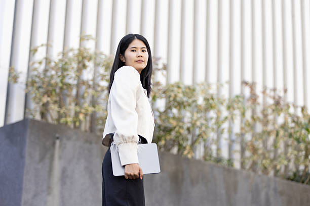 istock Future remote work combines technology smart phone connection online white digital business woman enable e-learning productivity while travel blend comfort modern devices serenity computer equipment 2203166309