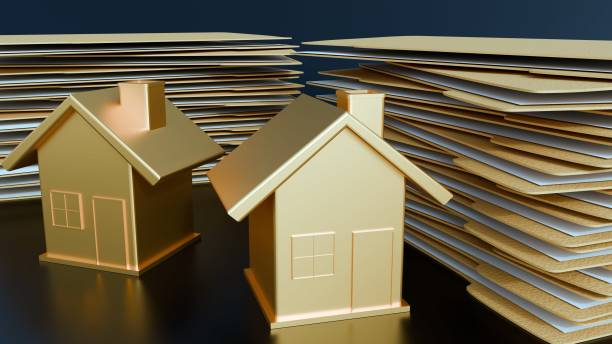 istock A miniature house with a stack of manila file folders 2203174780