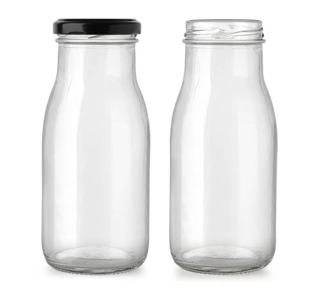 istock Two empty glass bottles showing open and closed with black cap 2203174904