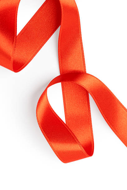 istock Red ribbon curled on white background symbolizing elegance and celebration 2203174909