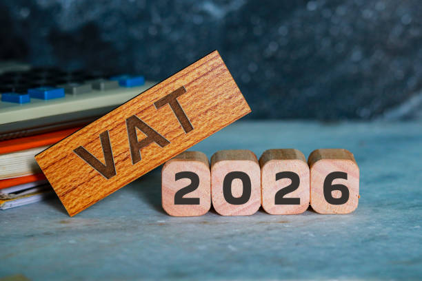 istock VAT 2026 on wooden cubes with calculator and notepad. 2203178234