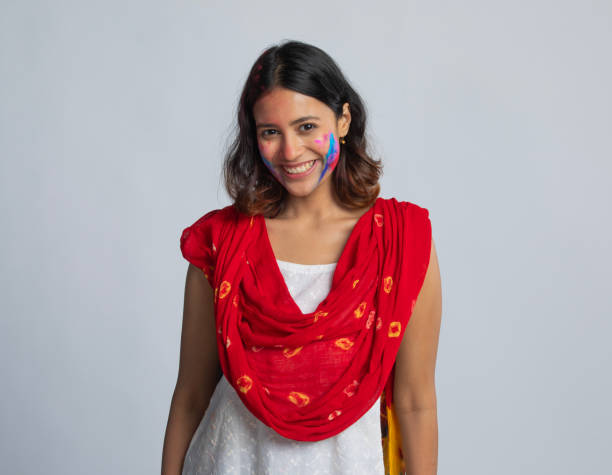 istock Happy woman celebrating Holi against white background 2203178552