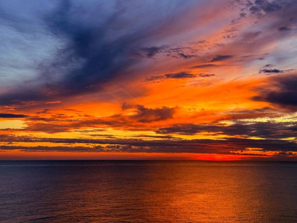 istock Stunning sunset clouds dramatic sky over sea at night. 2203181336