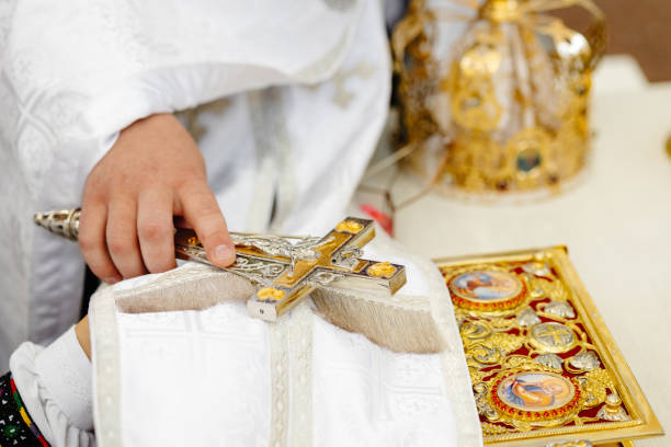 istock Priest holding a cross during a religious ceremony 2203181478