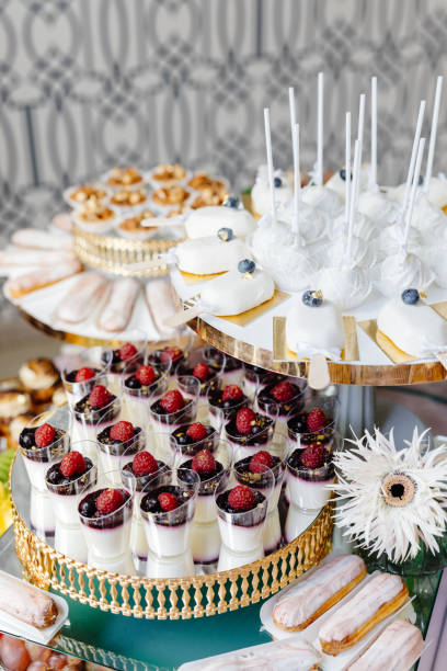 istock Catering service presenting delicious desserts and fruits on a table 2203181484