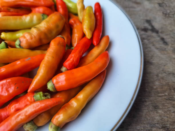 Red And Green Chilies On A Plate.