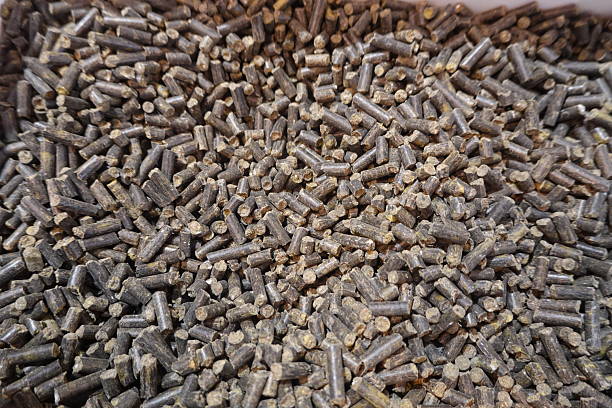 istock Organic fertilizer granules forming a textured background for sustainable agriculture 2203185359