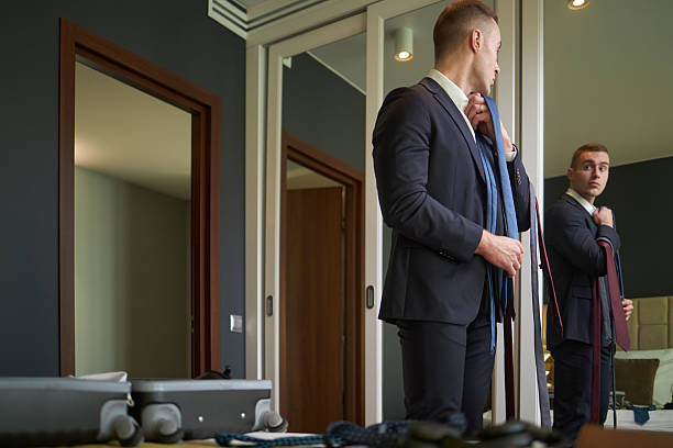 istock Grooming Suit Attire in Modern Bedroom Mirror Reflection 2203186458