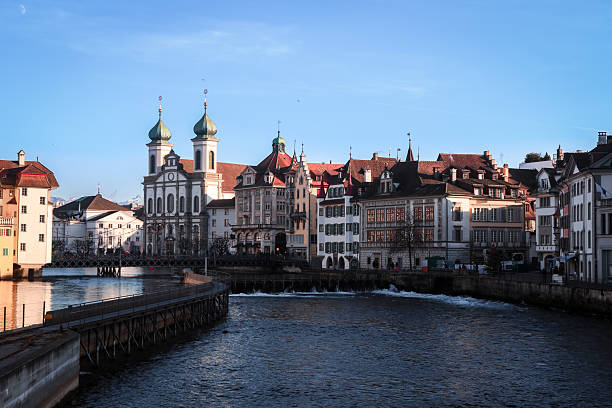 istock Historic waterfront buildings in Luzern under a clear blue sky at sunset 2203187445