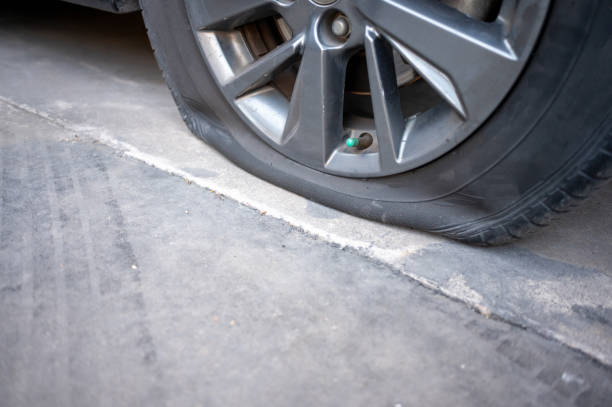 istock Vehicle Maintenance Importance . Regular tire checks and maintenance help prevent flats and ensure safer driving conditions. 2203187996