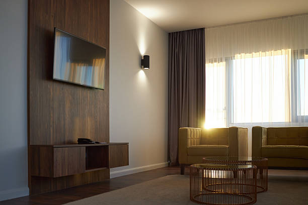 istock Cozy Living Room with Modern Wall-Mounted Television 2203189079