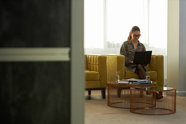 istock Woman Working on Laptop in Modern Office Setting 2203189449