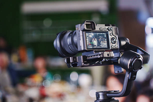 istock Camera setup on tripod during event for capturing moments and memories 2203191597