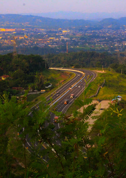 istock road between the hills 2203193580