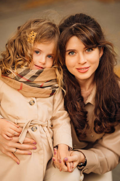 istock Mother and daughter enjoy a cozy moment outdoors during autumn 2203196830