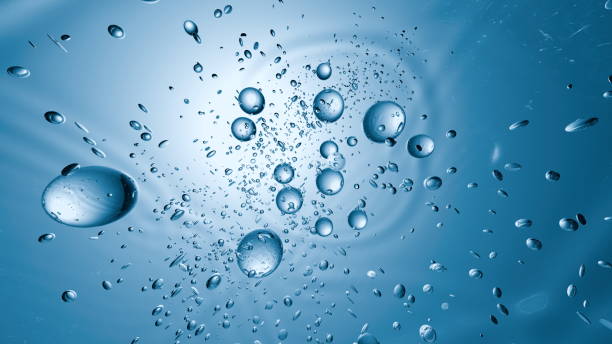 istock mesmerizing display of bubbles and water droplets floating through a vibrant blue setting, creating a dynamic, fluid visual that highlights the beauty of underwater movement. 3d render 2203197098