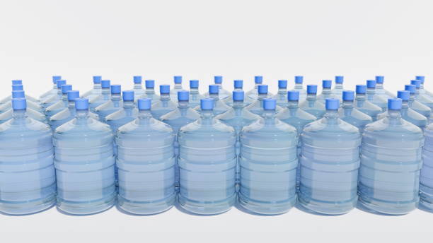 istock Multiple large bottles of water are lined up in a uniform row. Each bottle is transparent, displaying clean water inside, topped with blue caps, creating a visually appealing arrangement. 3d render 2203197105