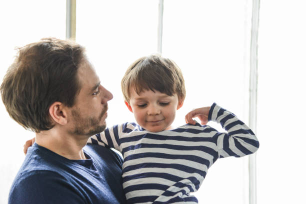 istock father and son have fun together 2203200139