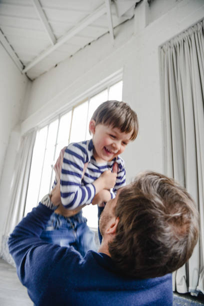 istock father waiting the son with arm raised 2203202804
