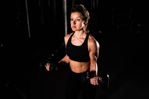 istock Woman working out with dumbbells 2203203163