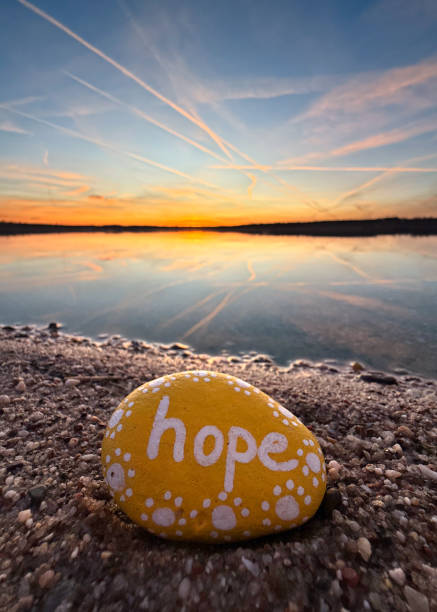 istock sunset on the beach in spring season with a yellow hope stone 2203203591