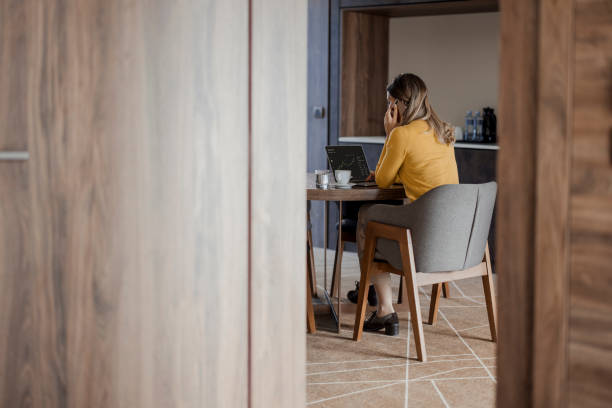 istock Freelancer Enjoying a Productive Workday in a Cozy Hotel Room 2203203841