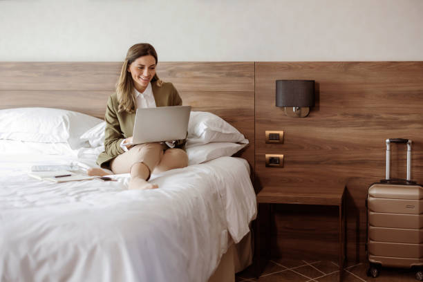 istock Corporate Glamour: Businesswoman in a Luxe Hotel Setting 2203203869