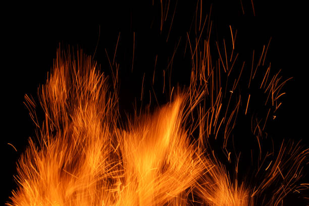 sparks from the fire glowing in the dark