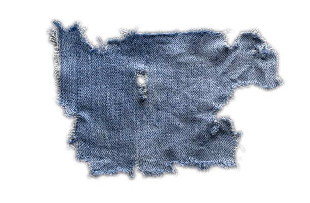 istock jeans. a frayed and torn piece of denim rag 2203205281
