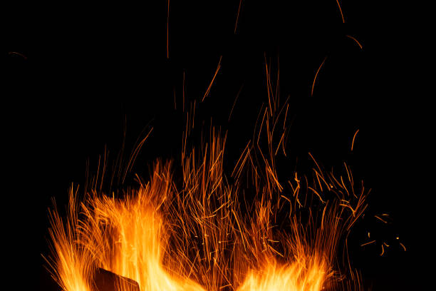 istock sparks from the fire glowing in the dark 2203205957