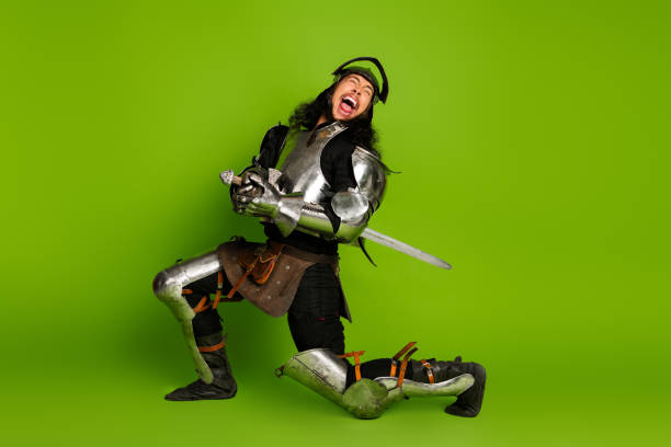 istock Armored Knight Expressing Passion on Vibrant Green Background, Capturing Medieval Essence with a Modern Twist 2203206005