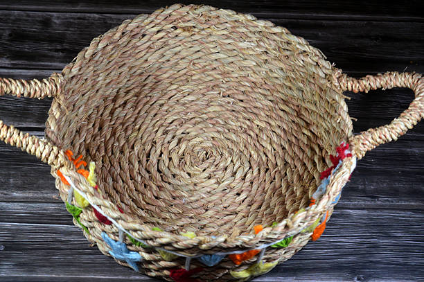 wicker tray container for food, Eco-friendly handmade decorative basket shaped with handles for serving bread, snack, food, fruits and various items, selective focus