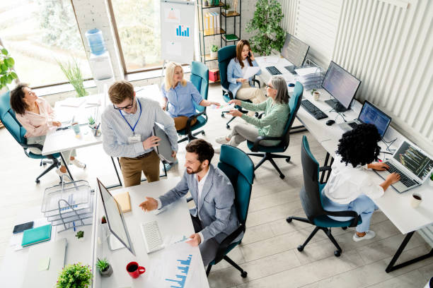 istock Professional office environment with diverse coworkers collaborating on projects in a modern workspace 2203206970