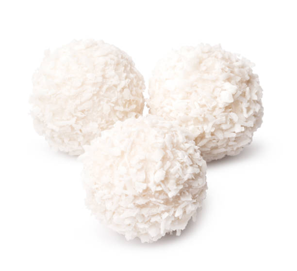 istock Sweet round coconut candy isolated on white 2203208359