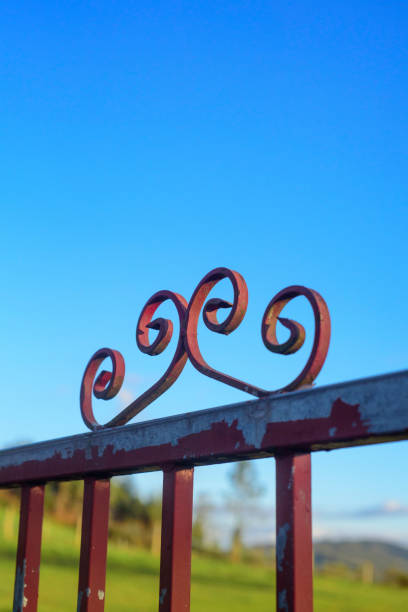 istock Spiral shapes in farm metal gate 2203209490