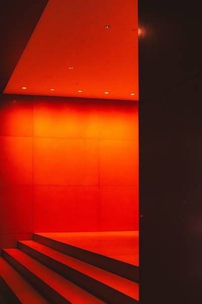 istock Modern interior with vibrant red lighting and sleek design. 2203209794