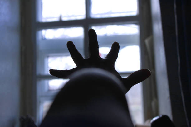 Close up to man joining his hands in prayer.