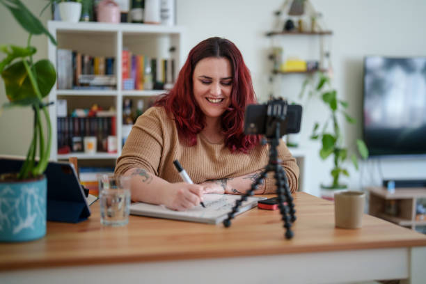 istock Woman using a whiteboard for online language lessons. 2203212284