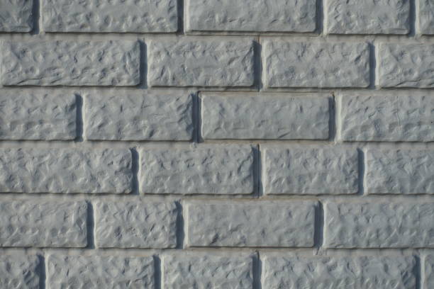 Close up of Light grey painted brick veneer wall
